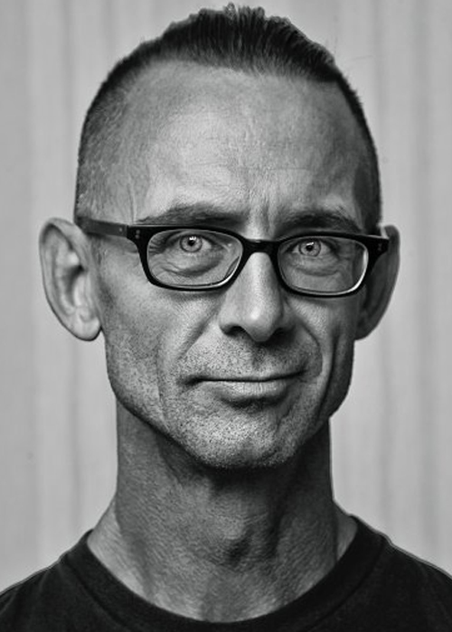 Black and white headshot of Chuck Palahniuk